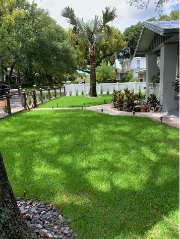 Randoms Lawn Care team working on a Tampa Bay property