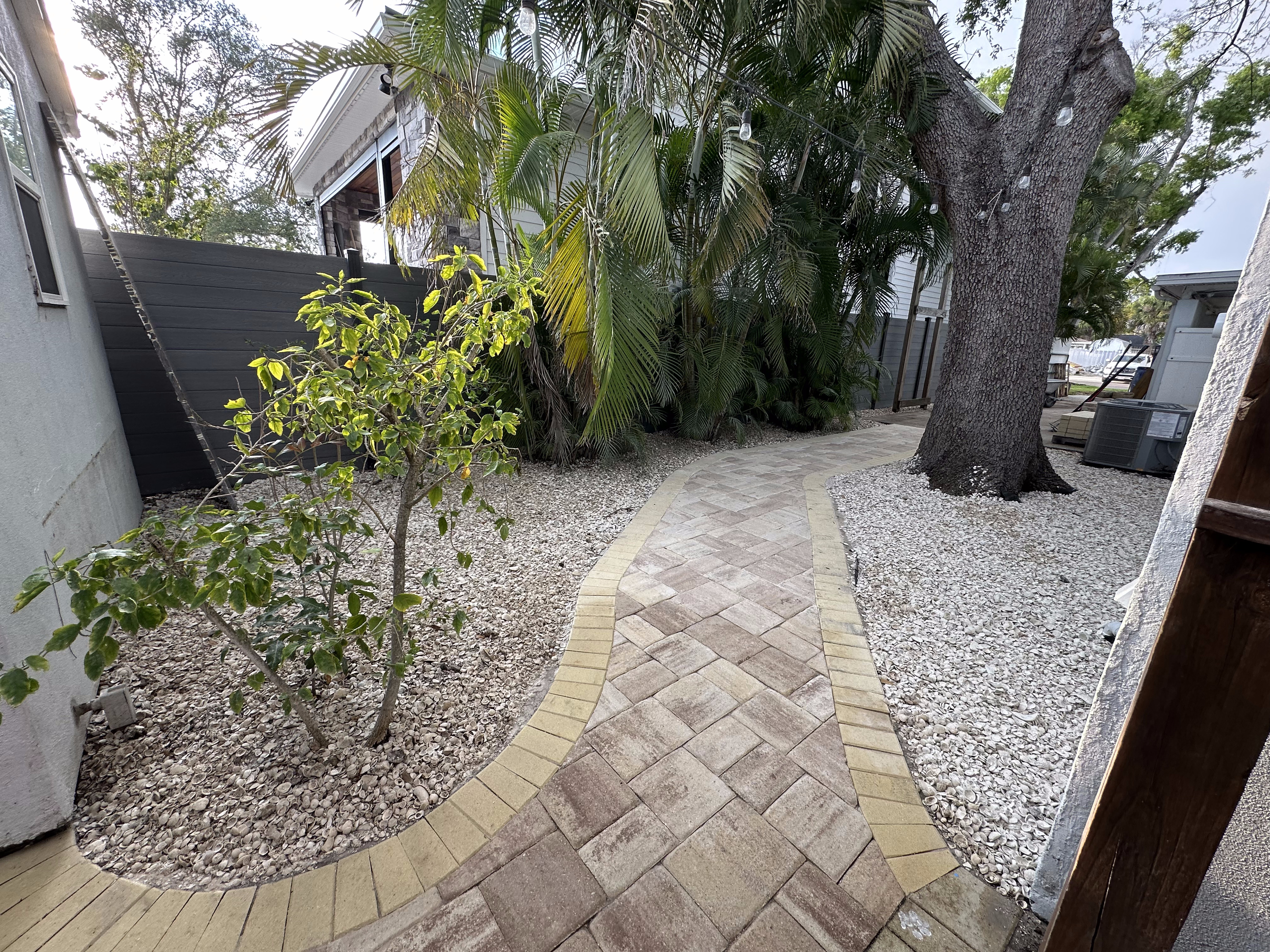 Custom paver pathway design by Randoms Lawn Care in Tampa Bay